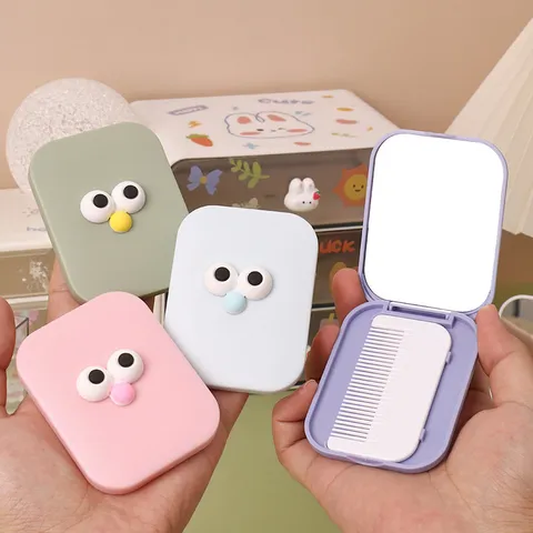 Portátil Lindo Dibujos Animados Ojos Grandes Plegable Espejo De Maquillaje Y Conjunto De Peine Plástico Vidrio Viaje Compacto Espejo Cosmético
