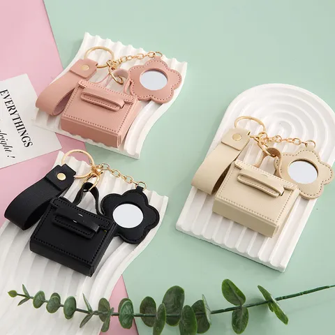 Llavero de Mini Bolso de Cuero PU Moderno Minimalista Colgante Estuche Auriculares Con Espejo Floral Correa de Muñeca