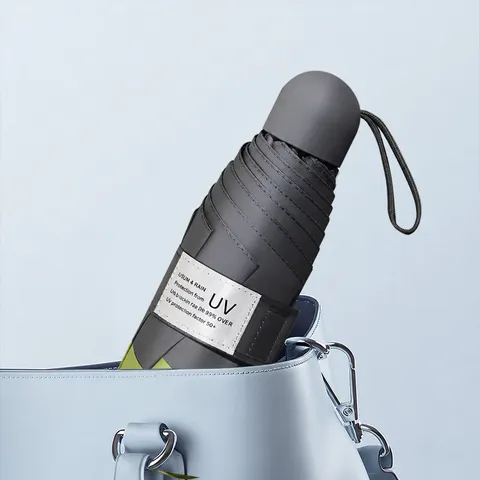 Mini Parapluie Capsule de Poche Pliable Protection UV Parapluie de Soleil Compact Imperméable Portable Voyage