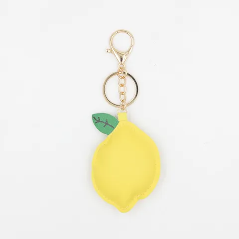 Llavero de Cuero PU con Forma de Limón Colgante para Bolso Linda Decoración Colgante de Frutas con Borla Pompon para Mujeres Niñas Llavero Colgante de Coche