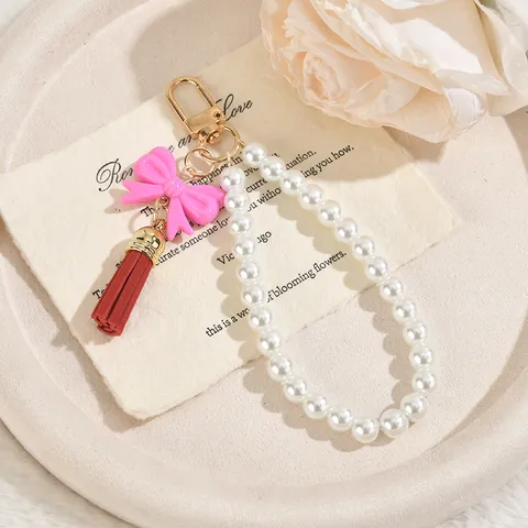 Portachiavi con Catena di Perle Artificiali e Fiocco Con Nappina in PU Ciondolo da Borsa Cinturino per Telefono Gioielli di Moda in Acrilico Regalo per Donne