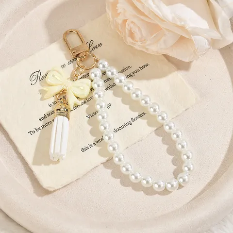 Portachiavi con Catena di Perle Artificiali e Fiocco Con Nappina in PU Ciondolo da Borsa Cinturino per Telefono Gioielli di Moda in Acrilico Regalo per Donne