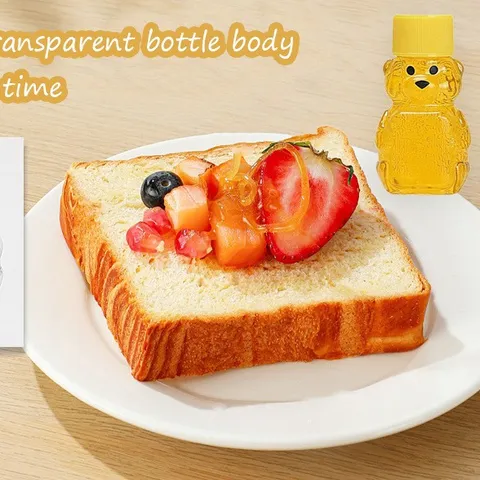 Transparente Plastik Bär Honig Flasche Süße Cartoon Saft Behälter Tragbare Getränkespender Mit Gelbem Deckel
