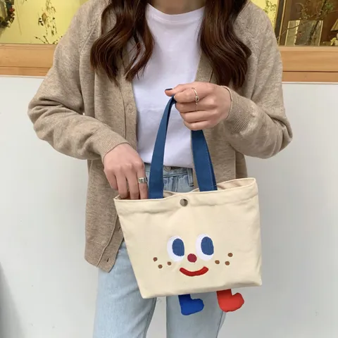 Cute Cartoon Face Canvas Bento Bag With 3D Legs For Women Student Portable Lunch Bag Mini Embroidered Handbag Tote Bag