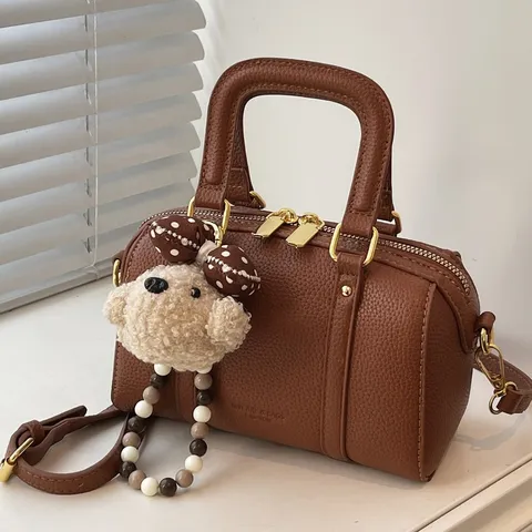Damen Retro Litschiprägung Kissen Tasche Mode PU Leder Umhängetasche Handtasche Mit Plüsch Tieranhänger Kleine Boston Tasche