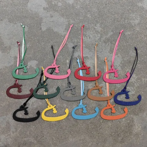 Genuine Leather Arabic Letter Bag Charm Modern Minimalist Pebbled Texture Car Hanging Ornament Solid Color Leather Strap Pendant Keychain Accessory