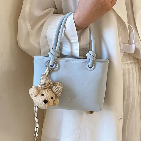 Damen PU Leder Eimertasche Minimalistisch Knoten Griff Handtasche Mit Bärenanhänger Mode Pendler Schulter Umhängetasche