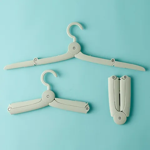 Percha Plegable de Viaje Mini Telescópica Portátil Dormitorio Multifuncional Turismo Viaje de Negocios Percha PP y Aluminio