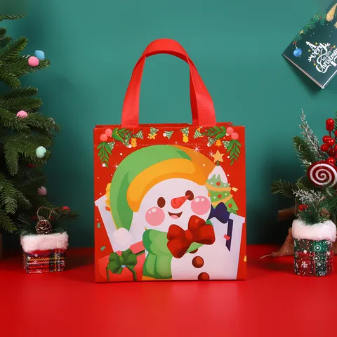 Navidad Tela No Tejida Impermeable Bolsa de Regalo Cartoon Papá Noel Muñeco de Nieve Alce Estampado Fiesta Bolsa de Embalaje
