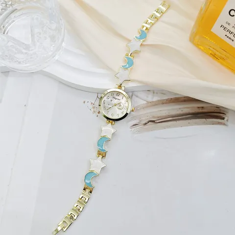 Women's Fashion Bracelet Watch Elegant Star Moon Pendant Gold Alloy Strap Quartz Watch Light Luxury Niche Ladies Jewelry Watch