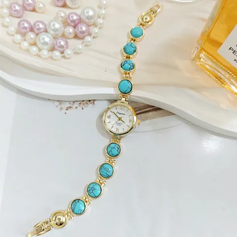Luxus Legierung Damen Quarz Armbanduhr Nische Elegant Eingelegt Künstlicher Stein Gold Metallband Mode Handkette Armbanduhr Schmuck Geschenk