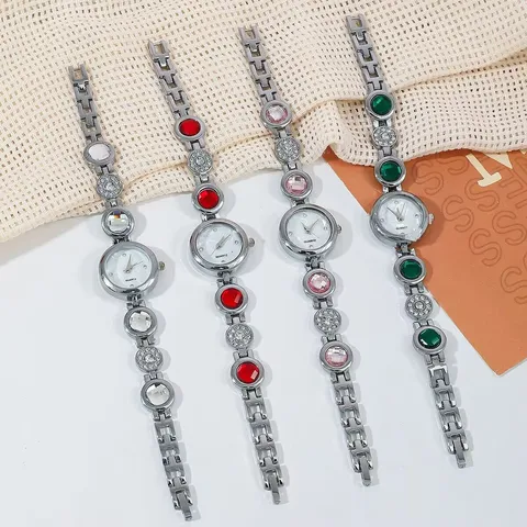 Damen Luxusmode Quarz Armbanduhr Eingelegte Strass Edelstein Legierung Metallkette Analog Schmuck Armbanduhr Für Damen