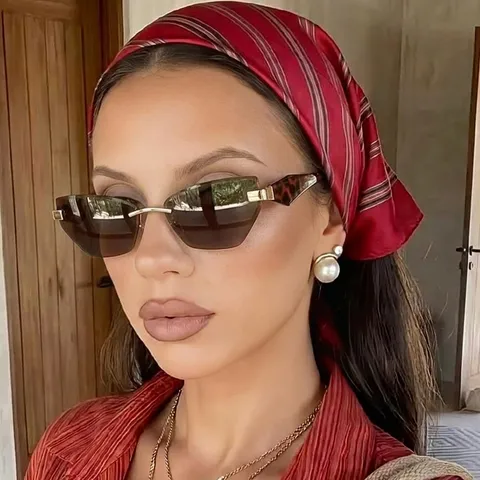Damen Unregelmäßig Katzenauge Randlose Sonnenbrille Mode Metallsteg PC Linse UV400 Schutz Für Outdoor Reise Street Style