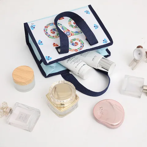 Borsa da toeletta impermeabile in tessuto non tessuto laminato Borsa per trucco con cerniera portatile Borsa per cosmetici da viaggio