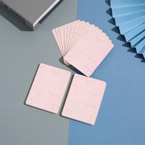 Tarjetas de Exhibición de Joyería Bronceadas de Estrella Rosa Y Bolsas OPP Transparentes Conjunto de Cartulina de Embalaje para Aretes y Collares