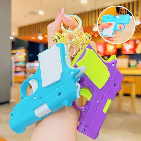 Portachiavi Mini Pistola Giocattolo Ravanello Cartone Animato Con Campanellino Anello Chiave Metallo Plastica Antistress Ciondolo Per Borsa Chiavi Accessorio