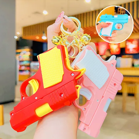 Portachiavi Mini Pistola Giocattolo Ravanello Cartone Animato Con Campanellino Anello Chiave Metallo Plastica Antistress Ciondolo Per Borsa Chiavi Accessorio