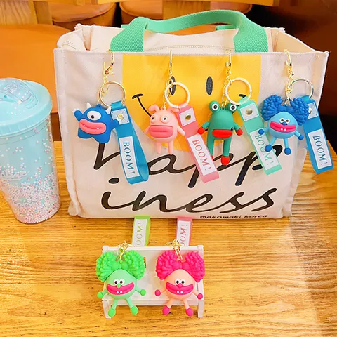 Cartoon Explosief Haar Dudu Figuur Sleutelhanger Koppel Tas Hanger PVC Sleutelring Met Letterband Schattige Pop