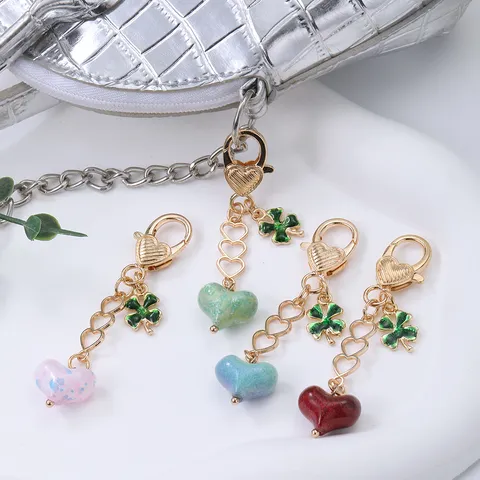 Creative Hollow Alloy Heart Bag Pendant Clover Keychain 3D Heart Lucky Grass Key Ring Phone Accessory Jewelry For Women