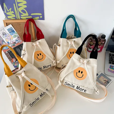 Damen Cartoon Smiley Gesicht Segeltuch Eimertasche Smile More Bedruckte Handtasche Kleine Umhängetasche Lunch Tasche Literarischer Stil