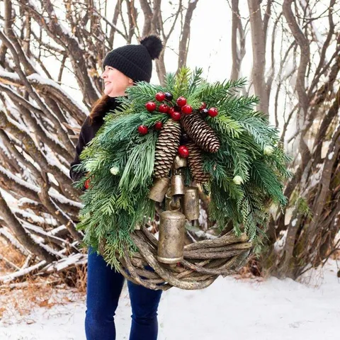 Farmhouse Boho Christmas Wreath With Rattan Ring Pine Cones Red Berries And Metal Bells For Front Door Wall Hanging Holiday Decor