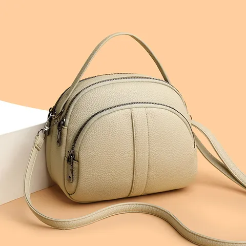 Sac Bandoulière Décontracté en Cuir PU pour Femmes Mode Couleur Unie Sac à Épaule Fermeture Éclair Multicouche Petit Sac Rond Quotidien