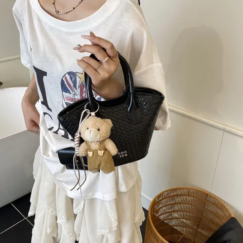 Womens Woven Bucket Bag PU Leather Casual Commuter Handbag Small Crossbody Purse With Plush Bear Pendant