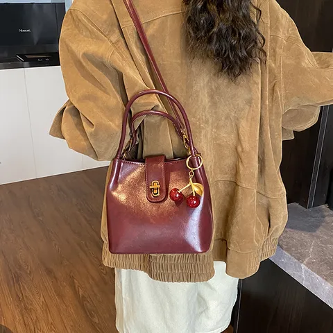 Women Fashion PU Leather Bucket Bag Vintage Retro Shoulder Crossbody Bag With Metal Lock And Cherry Pendant