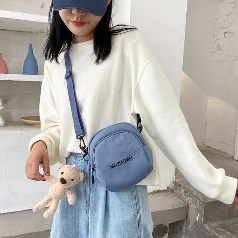 Ins Stijl Koreaanse Mode Casual Canvas Crossbody Tas Student Leuke Schoudertas Met Letterprint En Cartoon Hanger