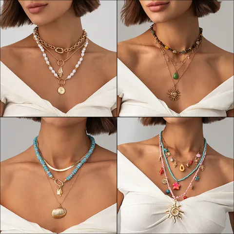 Collier Multi-rangs en Métal avec Pendentif pour Femme Exagéré Vintage Perle Artificielle Soleil Coquillage Étoile de Mer Ensemble Ras de Cou Bijoux de Vacances