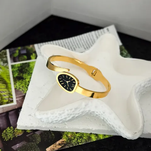 Orologio da Donna a Bracciale Elegante Quadrante Ovale Stile Coreano Oro Acciaio al Titanio Numeri Romani Orologio al Quarzo