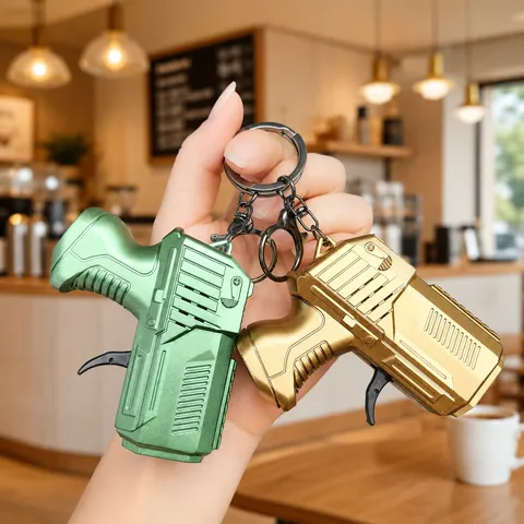 Creative Mini Pistol Keychain Novelty Stress Relief Gear Toy Simulation Drill Dinosaur Flint Key Ring Creative Kids Gift Pendant Accessory