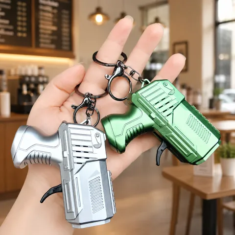 Creative Mini Pistol Keychain Novelty Stress Relief Gear Toy Simulation Drill Dinosaur Flint Key Ring Creative Kids Gift Pendant Accessory