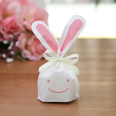 Sacs Cadeaux Mignons en Forme d'Oreilles de Lapin de Dessin Animé en Plastique Sacs à Bonbons Visage Souriant Avec Nœud en Ruban pour Fêtes d'Anniversaire d'Enfants Petits Sacs d'Emballage Cadeau pour Collations