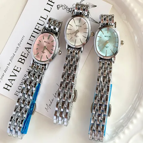 Montre à Quartz Élégante en Alliage et Acier Inoxydable pour Femme Cadran Ovale Bracelet en Métal Fermoir Papillon Montre Analogique Cadeau Mode