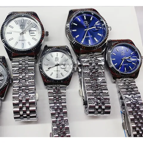 Reloj de Cuarzo Impermeable de Aleación y Acero Inoxidable Business Esfera Redonda Calendario Correa de Metal de Lujo para Parejas Hombres Mujeres