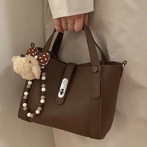 Women's Minimalist PU Leather Bucket Bag Casual Solid Color Handbag Retro Shoulder Crossbody Bag with Lock Closure