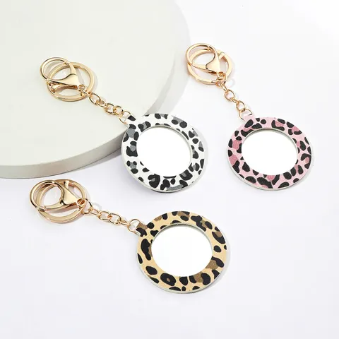 Porte-Clés Miroir de Poche Rond en Cuir PU Imprimé Léopard Joli Charme de Sac Miroir de Maquillage Portable Cadeau Anneau de Clés