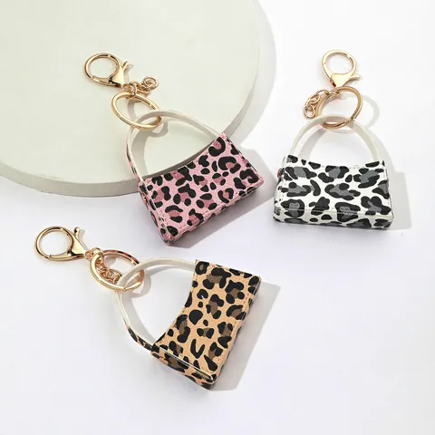 Porte-clés Mini Sac Courbé Imprimé Léopard en Cuir PU Porte-monnaie Mignon Chaîne de Clés Voiture Sac Suspendu Ornement Accessoires