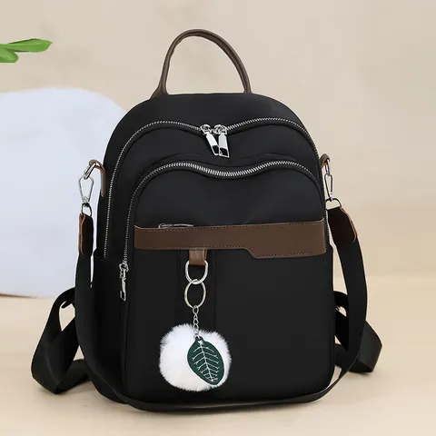 Donna Moda Casual Zaino in Nylon Semplice Borsa da Scuola Viaggio Zainetto Con Simpatico Ciondolo in Peluche Design a Blocco di Colore