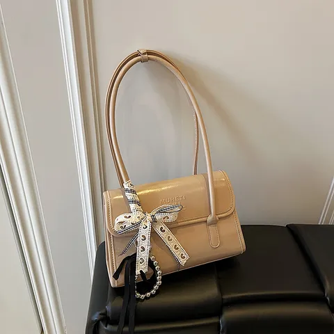 Französische Nische PU-Leder Damen Umhängetasche Stilvolle Schicke Unterarm Handtasche Mit Schleife Perle Anhänger Casual Tote Bag