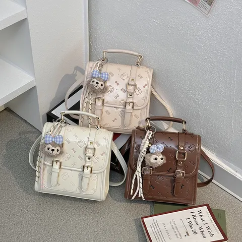 Mochila de Cuero PU para Mujer Vintage Casual Bolsa Escolar Pequeña Mochila de Viaje con Lindo Colgante de Peluche Bolso de Moda