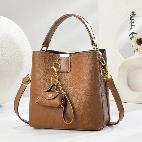Damen PU Leder Beuteltasche Mode Litschi Muster Umhängetasche Schultertasche Handtasche Mit Anhänger
