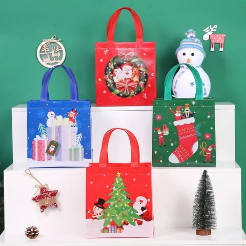 Christmas Non-Woven Gift Bag Waterproof Cartoon Tote Bag With Handle For Children Candy Holiday Party Packaging