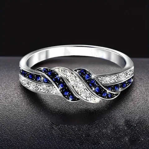 Anillo de Cobre con Circonia Azul y Blanca Entrelazada para Mujer Elegante Anillo de Dedo Plateado Geométrico Joyería de Moda