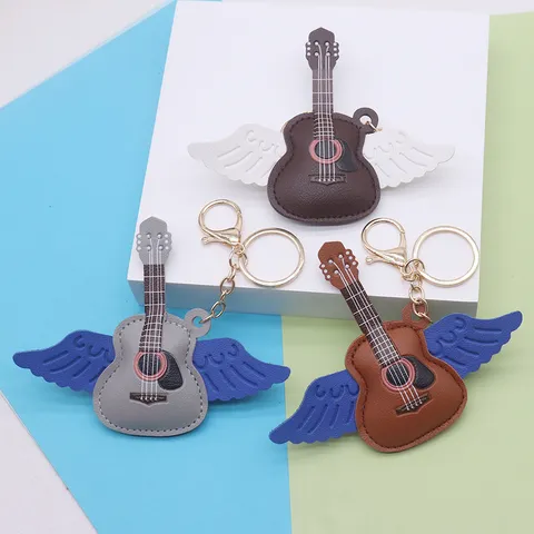 Pendentif en Cuir Créatif Forme Guitare avec Ailes d'Ange Porte-Clés Bijou de Sac pour Fans de Concert Femme Homme Alliage Cuir PU