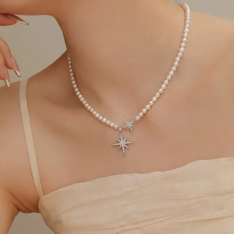 Elegante Collana con Ciondolo a Stella a Otto Punte per Donna Perla Artificiale Zirconia Intarsiata Catena in Rame Gioielli Moda Regalo