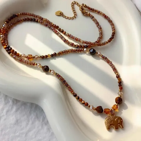 Collana con Pendente a Elefante in Acciaio al Titanio Perline Caffè Pietra Occhio di Tigre Catena Lunga per Maglione Donna Gioielli