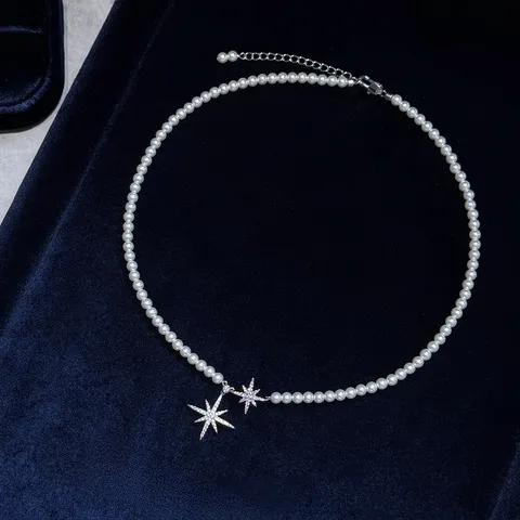 Elegante Collana con Ciondolo a Stella a Otto Punte per Donna Perla Artificiale Zirconia Intarsiata Catena in Rame Gioielli Moda Regalo