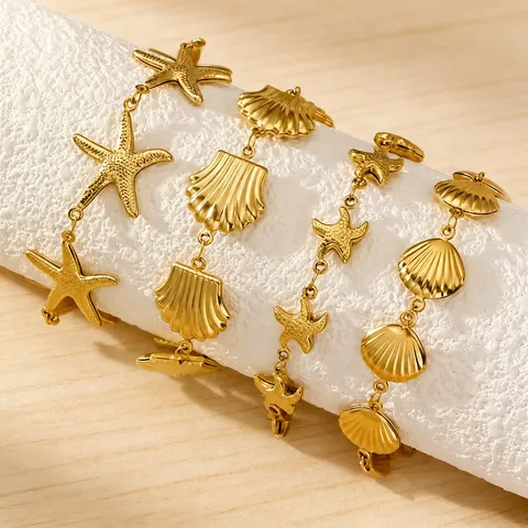Pulsera de Acero Inoxidable con Estrella de Mar y Concha Hebilla OT para Mujer Estilo Resort Oceánico Bañada en Oro